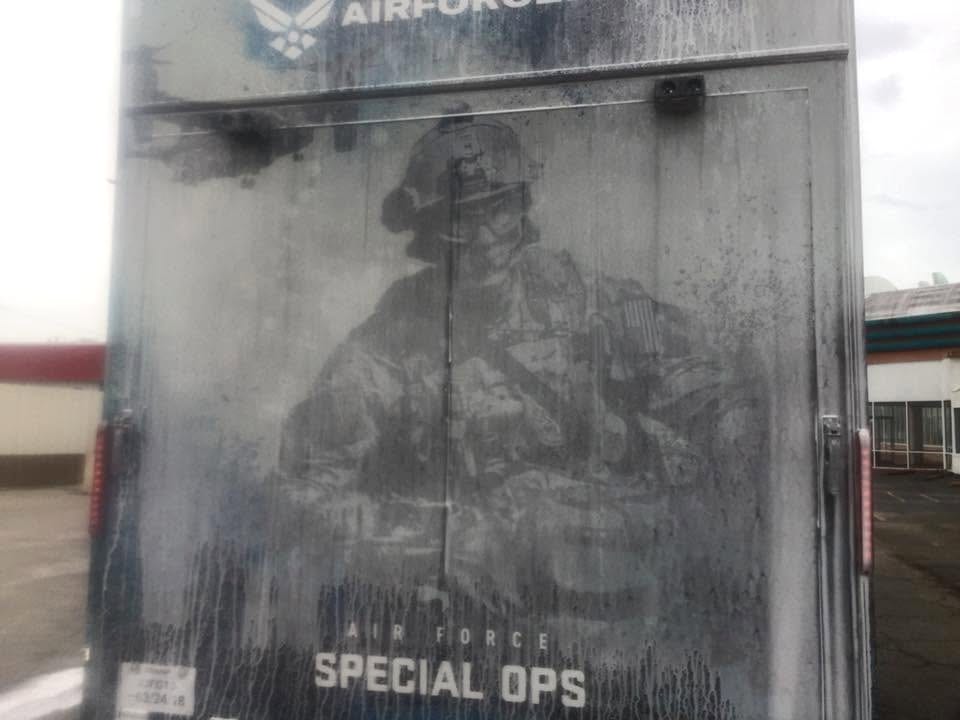 Before: grime-covered U.S. Air Force trailer wrap, graphics barely visible