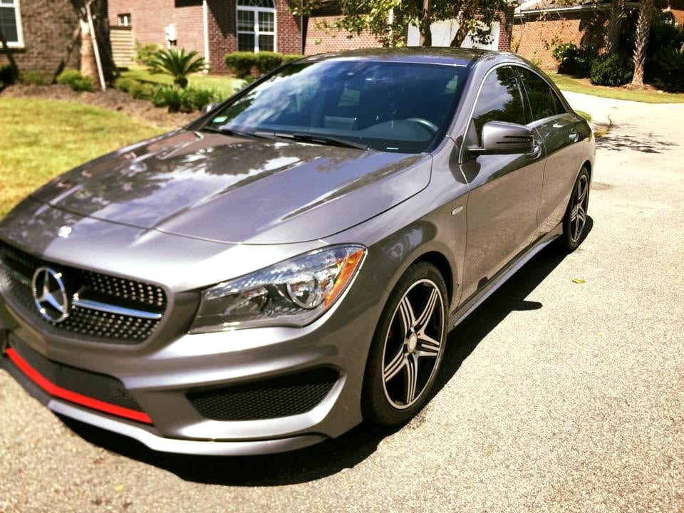 Glossy silver sedan after a hand wash and wax, paint reflecting cleanly