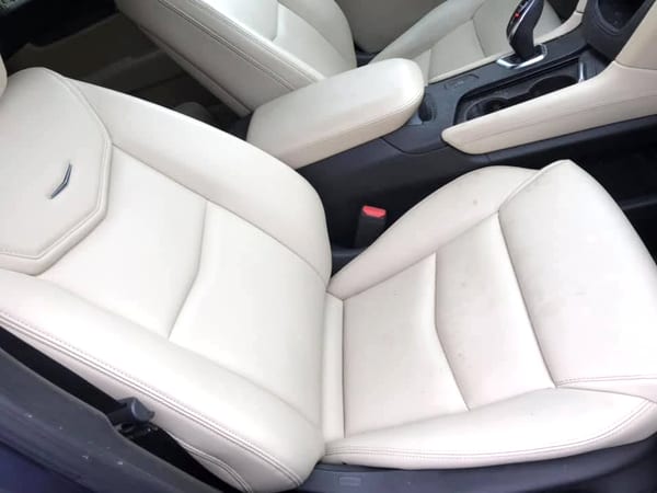 Clean cream leather seats after interior detailing