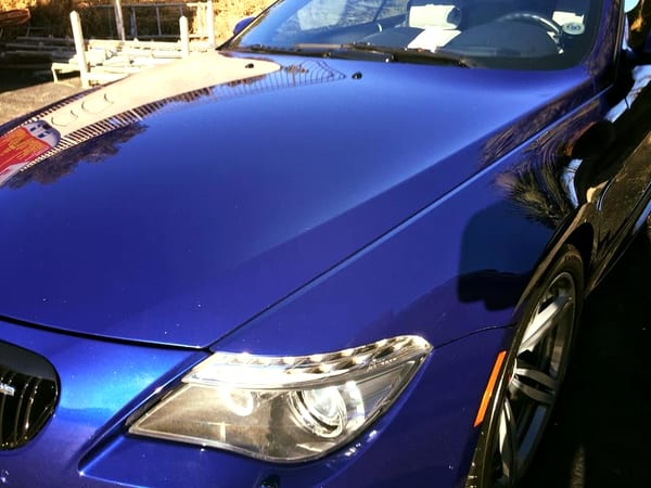 Restored, crystal-clear headlight lens on a detailed sports car
