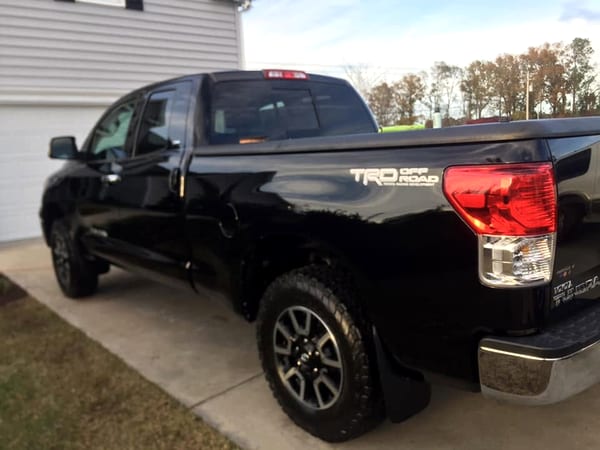 Corrected black truck paint reflecting clearly with swirls removed